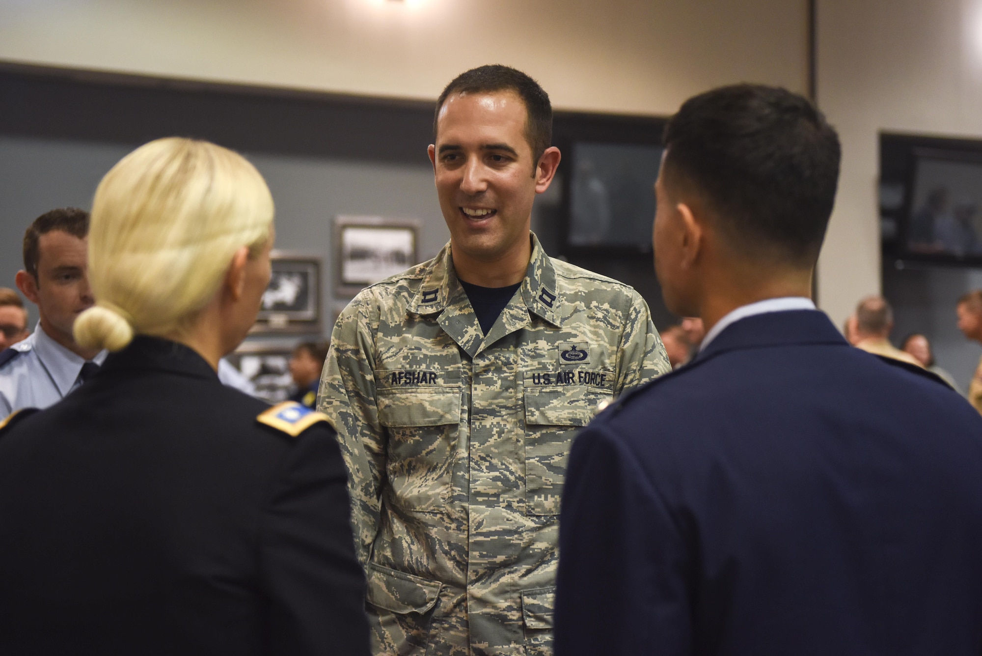 U.S. Air Force Capt. Todd Afshar, 315th Training Squadron Flight Commander, introduces himself to Col. Ricky Mills, 17th Training Wing Commander, at the Event Center on Goodfellow Air Force Base, Texas, July 21, 2017. Col. Mills met base personnel to learn more about the mission and the Airmen that enable it. (U.S. Air Force photo by Airman 1st Class Chase Sousa/Released)