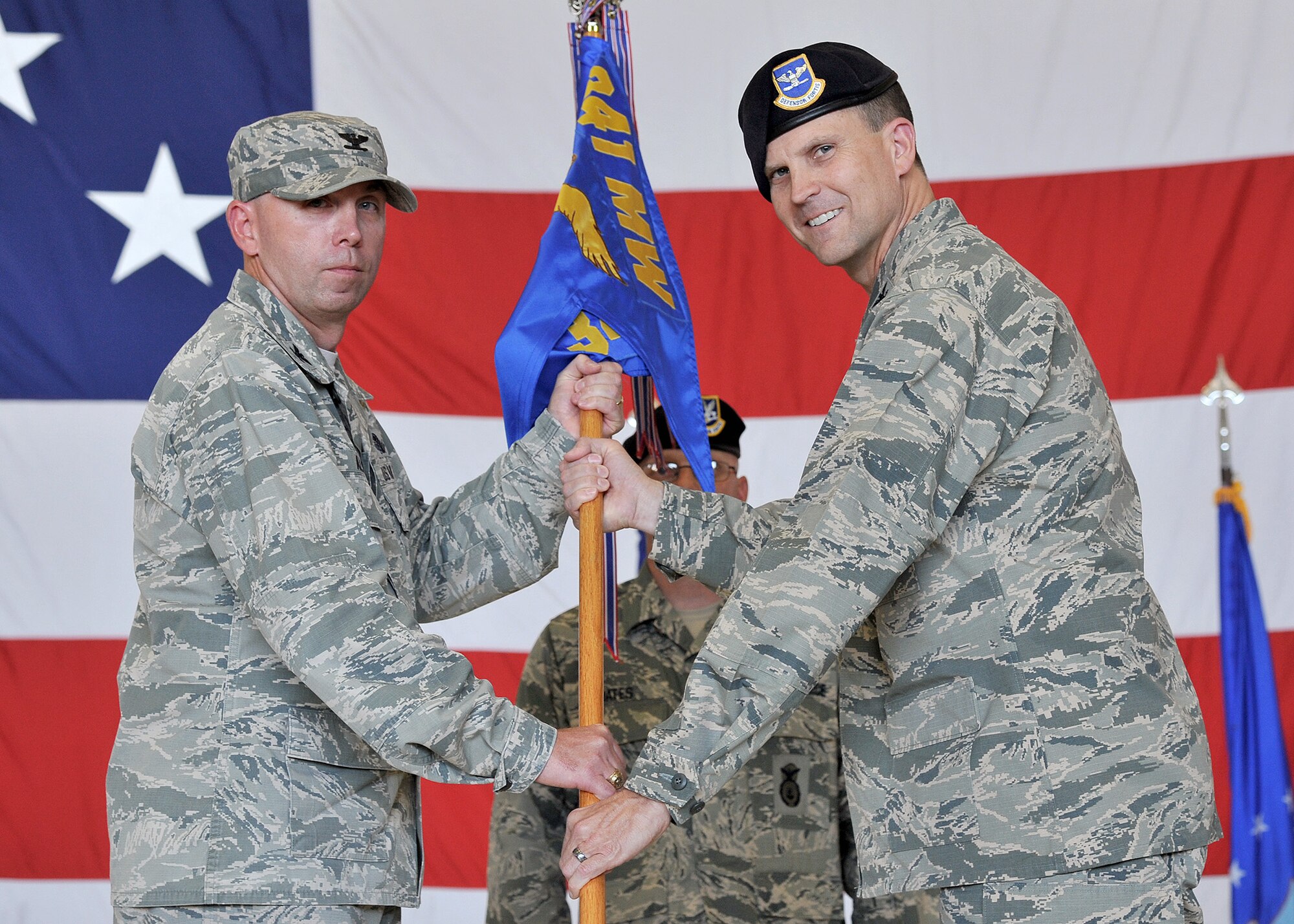 Col. Aaron Guill, right, accepts command of the 341st Security Forces Group from Col. Ron Allen, 341st Missile Wing commander, July 14, 2017, at Malmstrom Air Force Base, Mont. (U.S. Air Force photo/John Turner)