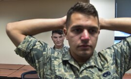 Airman 1st Class Christopher Garren, 437th Maintenance Squadron crew chief, conducts a search procedure during security forces augmentee training at Joint Base Charleston, S.C., July 18, 2017. The training teaches Airmen handcuff and searching procedures, weapons familiarization and firing, entry control procedures and less-than lethal weapons training. 