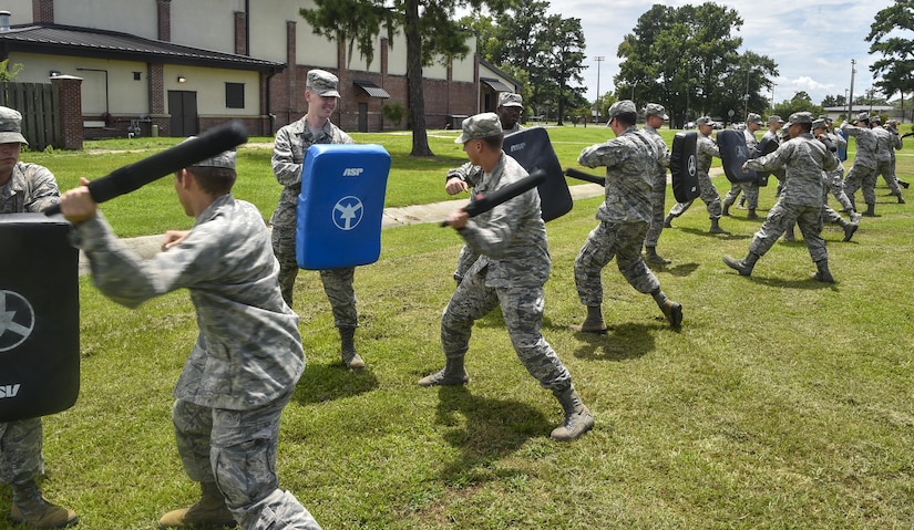 Airmen practice with less-than-lethal weapons during an augmentee training course at Joint Base Charleston, S.C., July 18, 2017. Augmentees are called to service during emergencies as well as situations where extra security forces members are needed. 