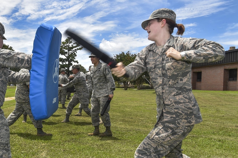 Airman 1st Class Roslyn Ward, 1st Combat Camera Squadron broadcast journalist, practices less-than-lethal combat during augmentee training at Joint Base Charleston, S.C., July 18, 2017. Augmentees are called to service in emergencies as well as situations where extra security forces members are needed.