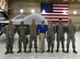 Secretary of the Air Force Heather Wilson shares a photo with members of the 432nd Aircraft Maintenance Squadron, July 19, 2017, at Creech Air Force Base, Nev. The AMXS maintainers briefed the SecAF on the MQ-1 Predator and MQ-9 Reaper specifics. (U.S. Air Force photo/Senior Airman Christian Clausen)