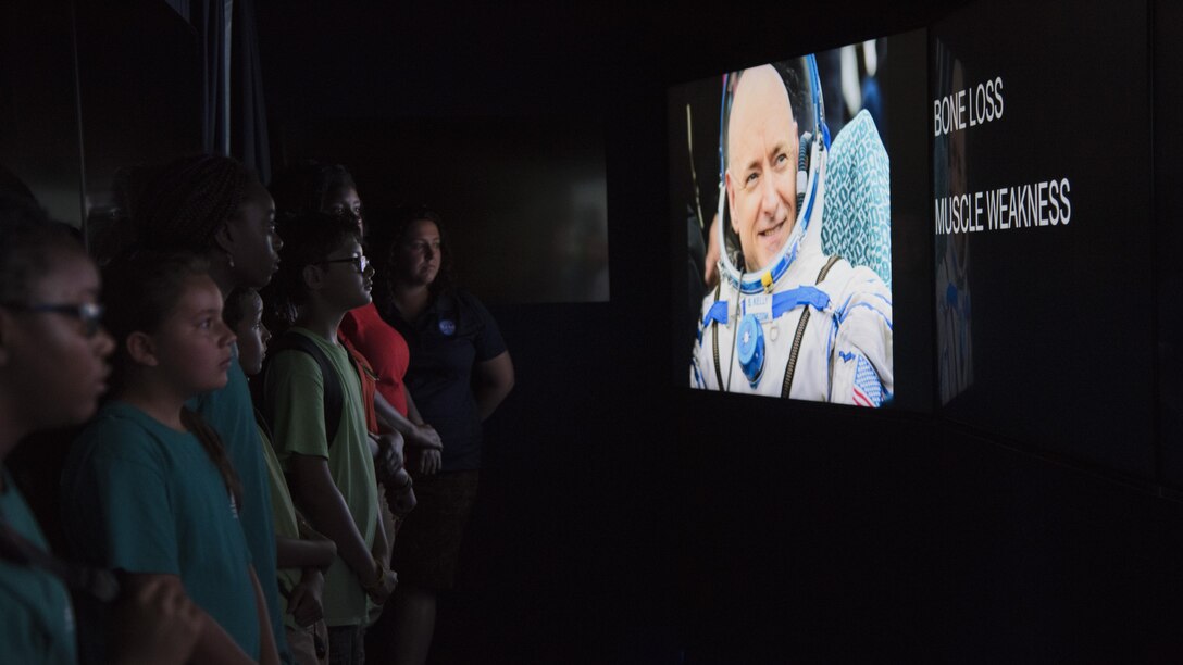 Participants watch a video in a mobile exhibit during a National Aeronautics and Space Administration’s Science, Technology, Engineering, and Mathematics Day at Joint Base Andrews, Md., July 14, 2017. Attendees learned about the International Space Station’s role in human exploration efforts that allow the space program to perform experiments and scientific research in microgravity. (U.S. Air Force photo by Airman 1st Class Valentina Lopez)