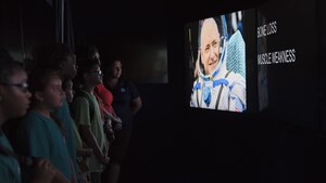 Participants watch a video in a mobile exhibit during a National Aeronautics and Space Administration’s Science, Technology, Engineering, and Mathematics Day at Joint Base Andrews, Md., July 14, 2017. Attendees learned about the International Space Station’s role in human exploration efforts that allow the space program to perform experiments and scientific research in microgravity. (U.S. Air Force photo by Airman 1st Class Valentina Lopez)