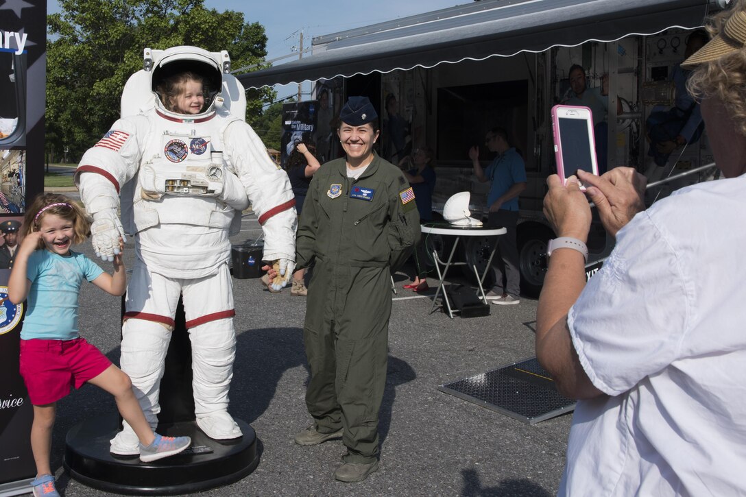 Participants pose for a photograph during a National Aeronautics and Space Administration’s Science, Technology, Engineering, and Mathematics Day at Joint Base Andrews, Md., July 14, 2017. Attendees learned about advanced human research which ensure the safety of future missions exploring beyond low Earth orbit. (U.S. Air Force photo by Airman 1st Class Valentina Lopez)