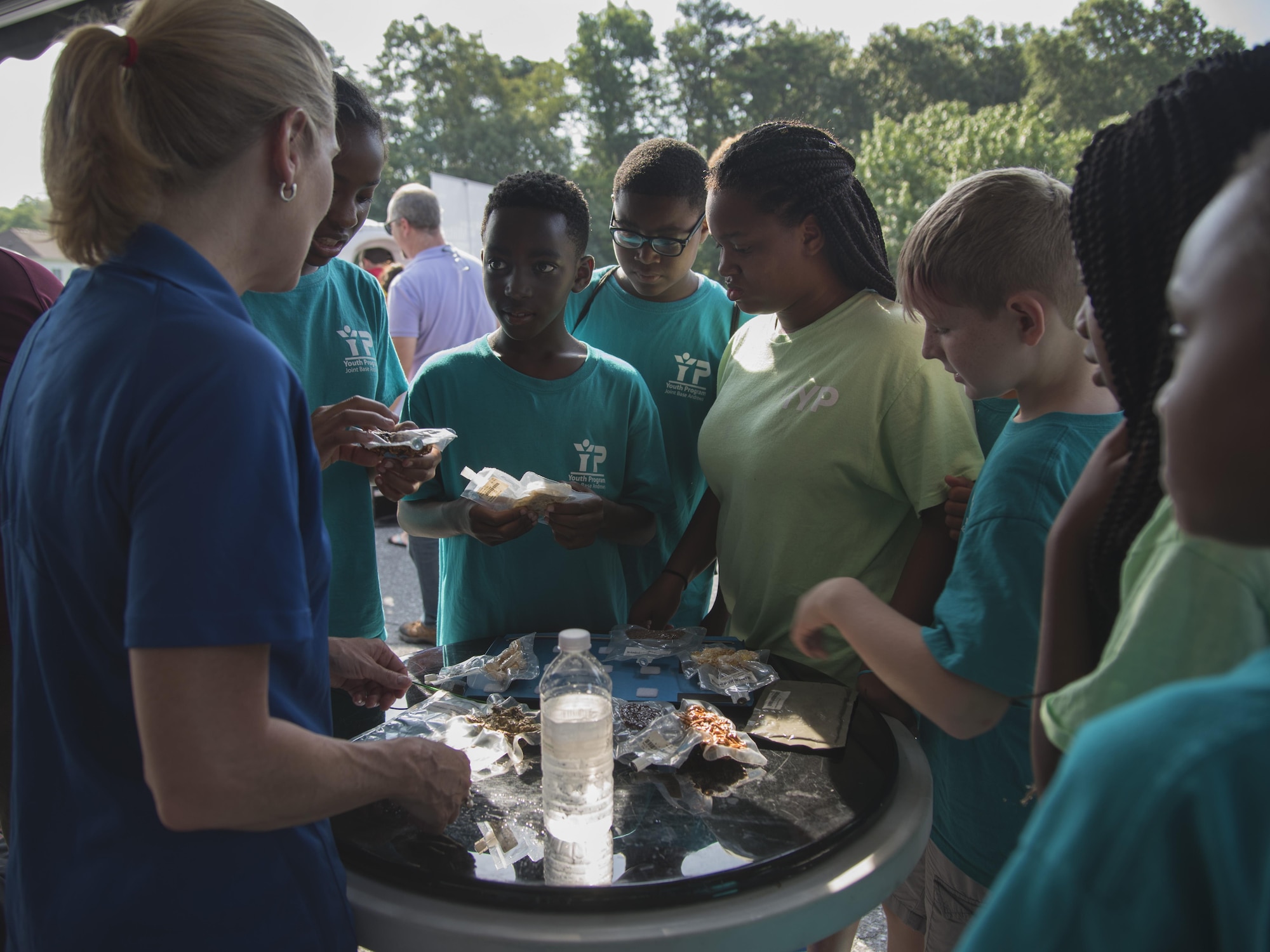 Participants examine astronaut food during a National Aeronautics and Space Administration’s Science, Technology, Engineering, and Mathematics Day at Joint Base Andrews, Md., July 14, 2017. Participants learned about spaceman nutrition, astronaut suits and the International Space Station. (U.S. Air Force photo by Airman 1st Class Valentina Lopez)