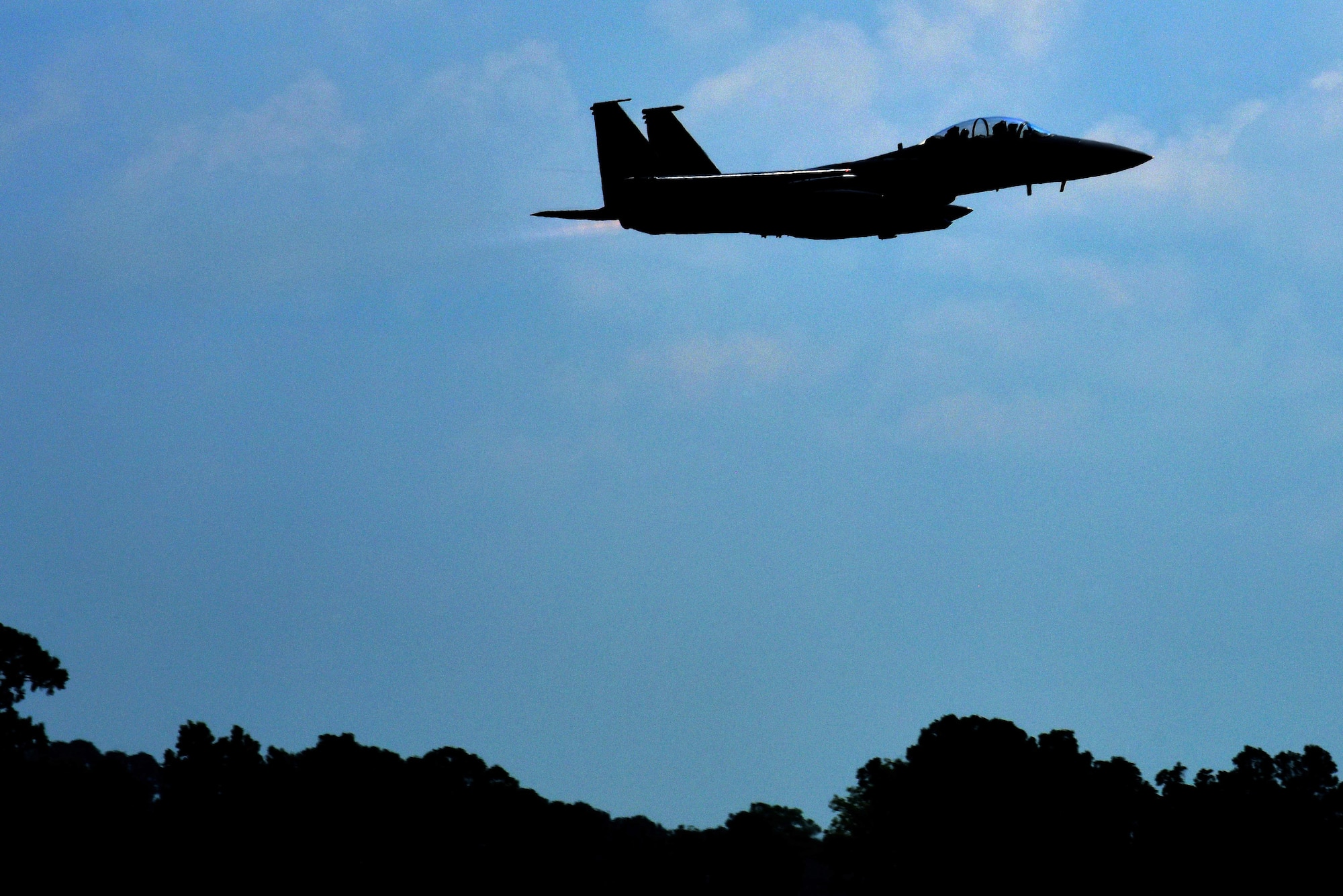 An F-15E Strike Eagle soars through the air during Exercise Thunderdome 17-02, July 21, 2017, at Seymour Johnson Air Force Base, North Carolina. The scenario required the 4 FW to prepare and deploy more than 400 Airmen and more than 300 tons of cargo and equipment needed to provide F-15E capability and mission support to simulated regional commanders. (U.S. Air Force photo by Senior Airman Ashley Maldonado)