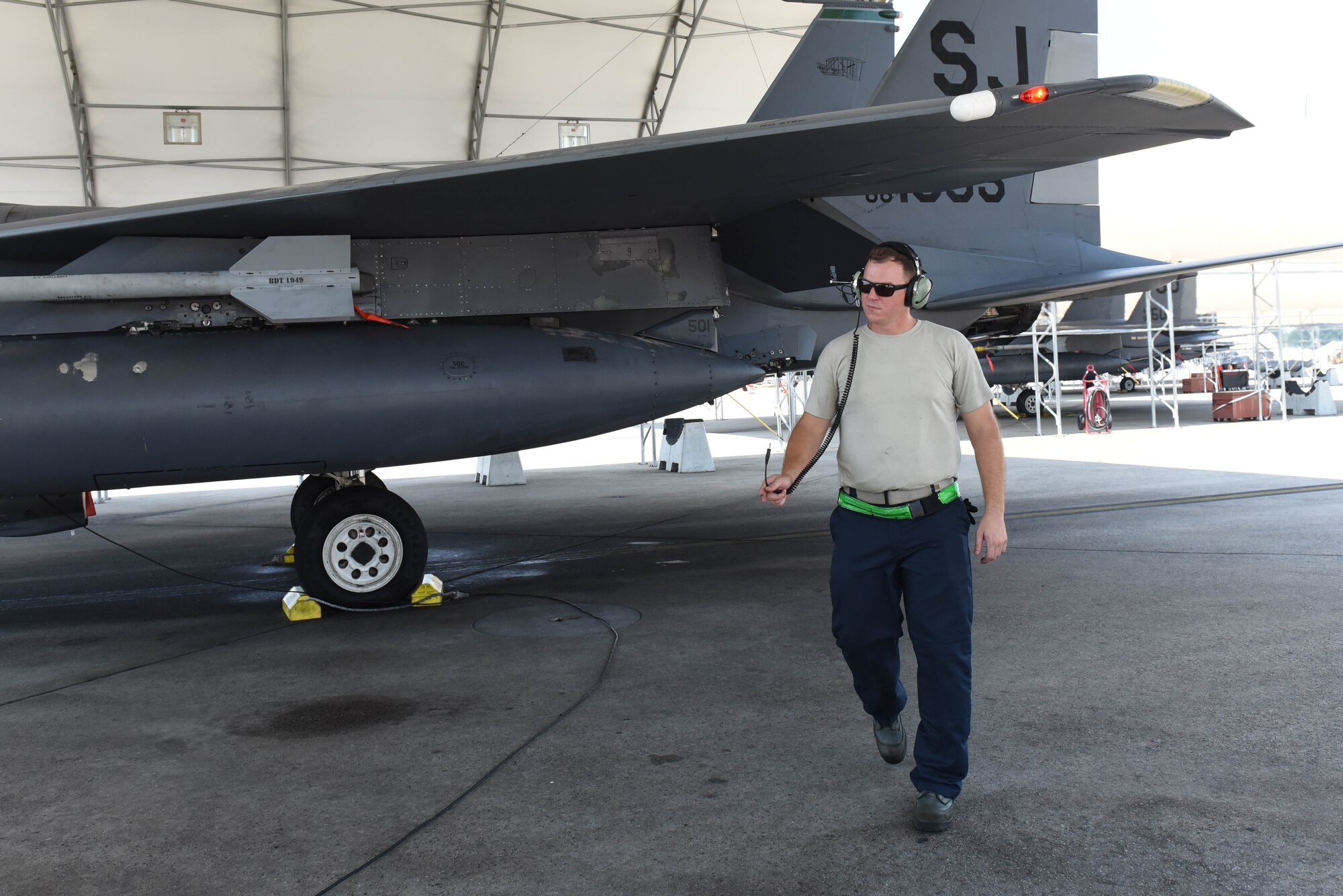 Staff Sgt. Colten Lingley, 4th Aircraft Maintenance Squadron engines specialist, inspects the F-15E Strike Eagle during Exercise Thunderdome 17-02, July 21, 2017, at Seymour Johnson Air Force Base, North Carolina. The exercise served to evaluate the 4th Fighter Wing’s ability to rapidly deploy Airmen and aircraft for contingency operations. (U.S. Air Force photo by Airman 1st Class Victoria Boyton)