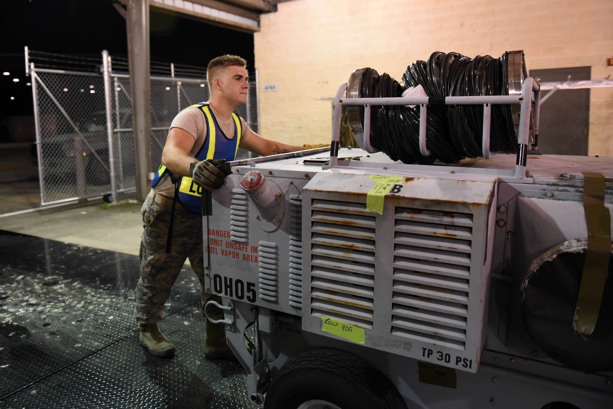 Staff Sgt. Branden Lashhorn, 4th Civil Engineer Squadron structural technician, removes a heating cart from a weighing scale during exercise Thunderdome 17-02, July 20, 2017, at Seymour Johnson Air Force Base, North Carolina. During the exercise, members of the 4th Fighter Wing conducted simulated cargo transport. (U.S. Air Force photo by Airman 1st Class Victoria Boyton)