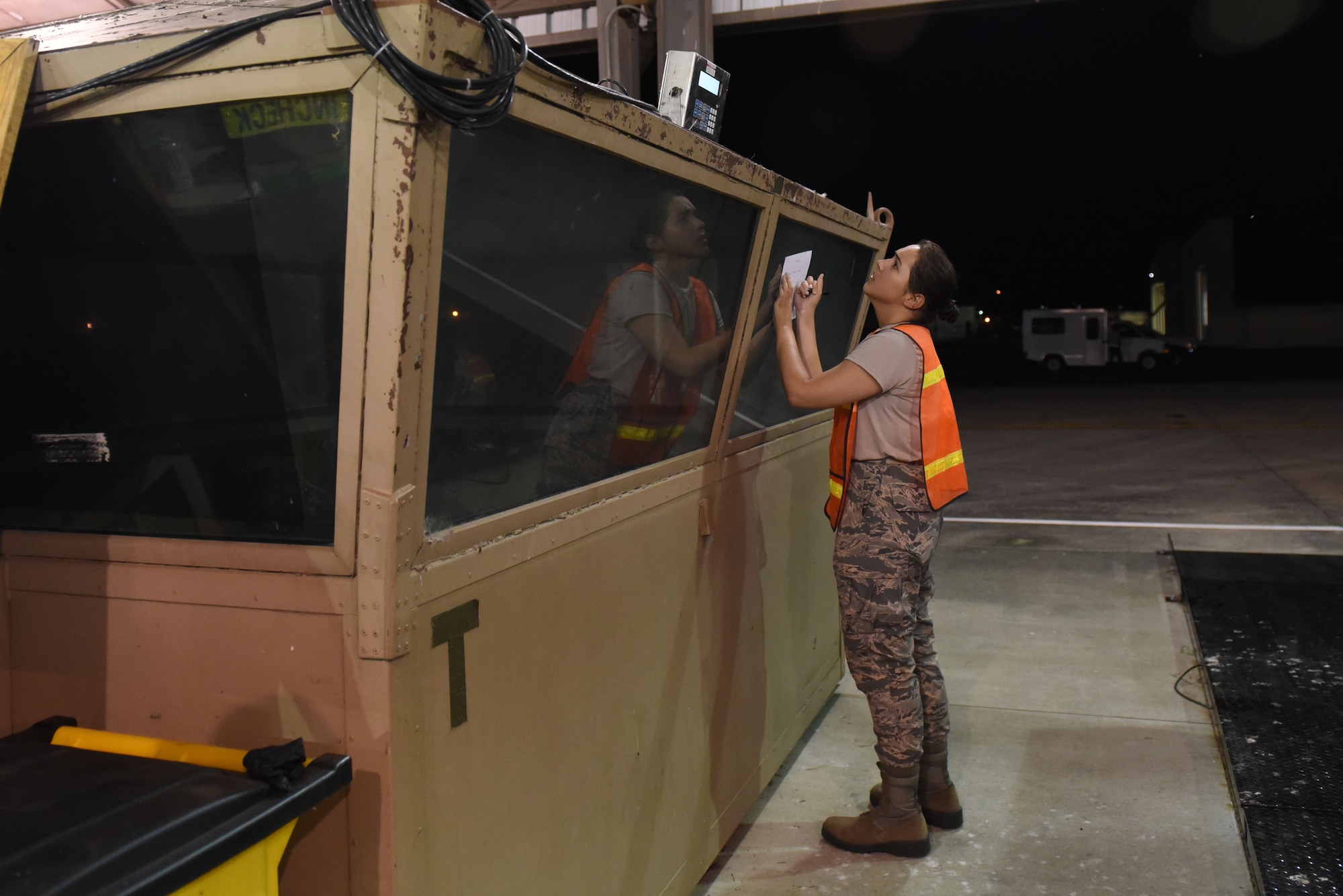 Airman 1st Class Mackenzie Sones, 4th Logistics Readiness Squadron receiving technician, records the cargo weight during exercise Thunderdome 17-02, July 20, 2017, at Seymour Johnson Air Force Base, North Carolina. The exercise allowed members of the 4th Fighter Wing to strengthen skills for real-world operations. (U.S. Air Force photo by Airman 1st Class Victoria Boyton)