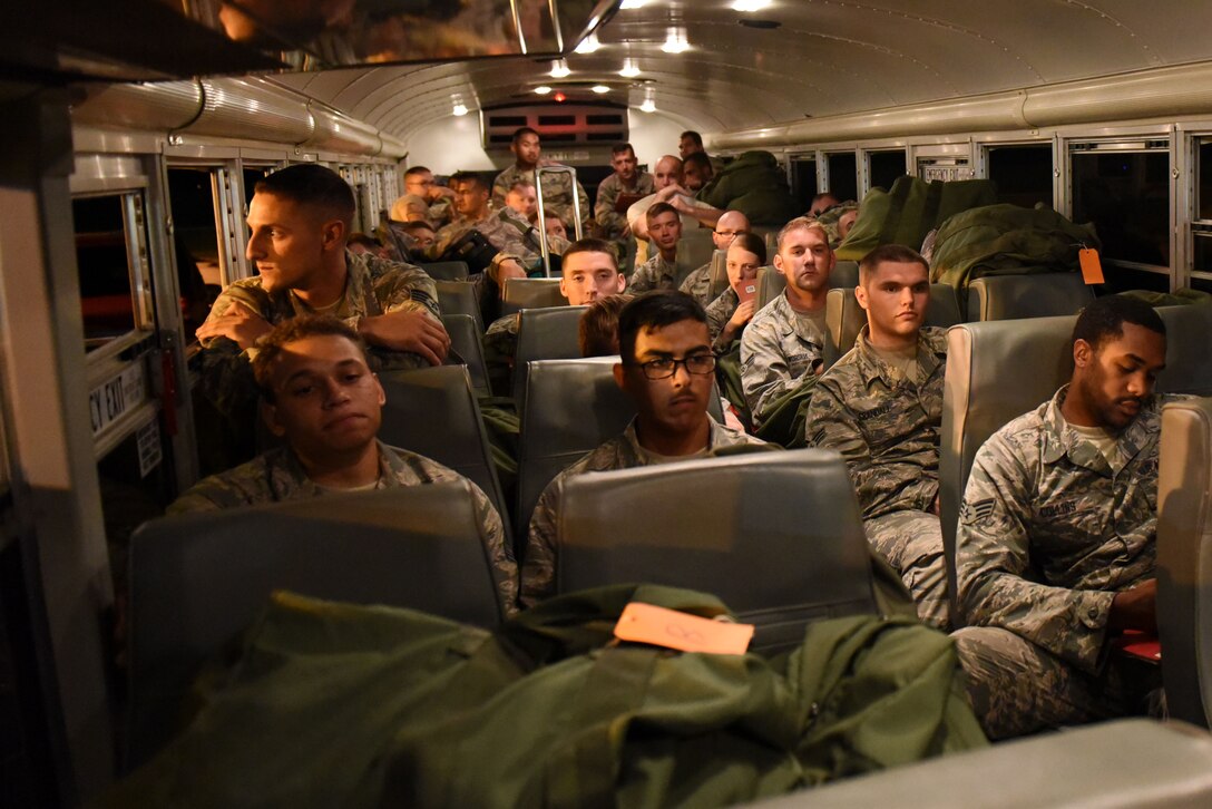 Participants of exercise Thunderdome 17-02 transit to the passenger terminal, July 20, 2017, at Seymour Johnson Air Force Base, North Carolina. By working together during the exercise, members of the 4th Fighter Wing continue to enhance deployment operations. (U.S. Air Force photo by Airman 1st Class Victoria Boyton)