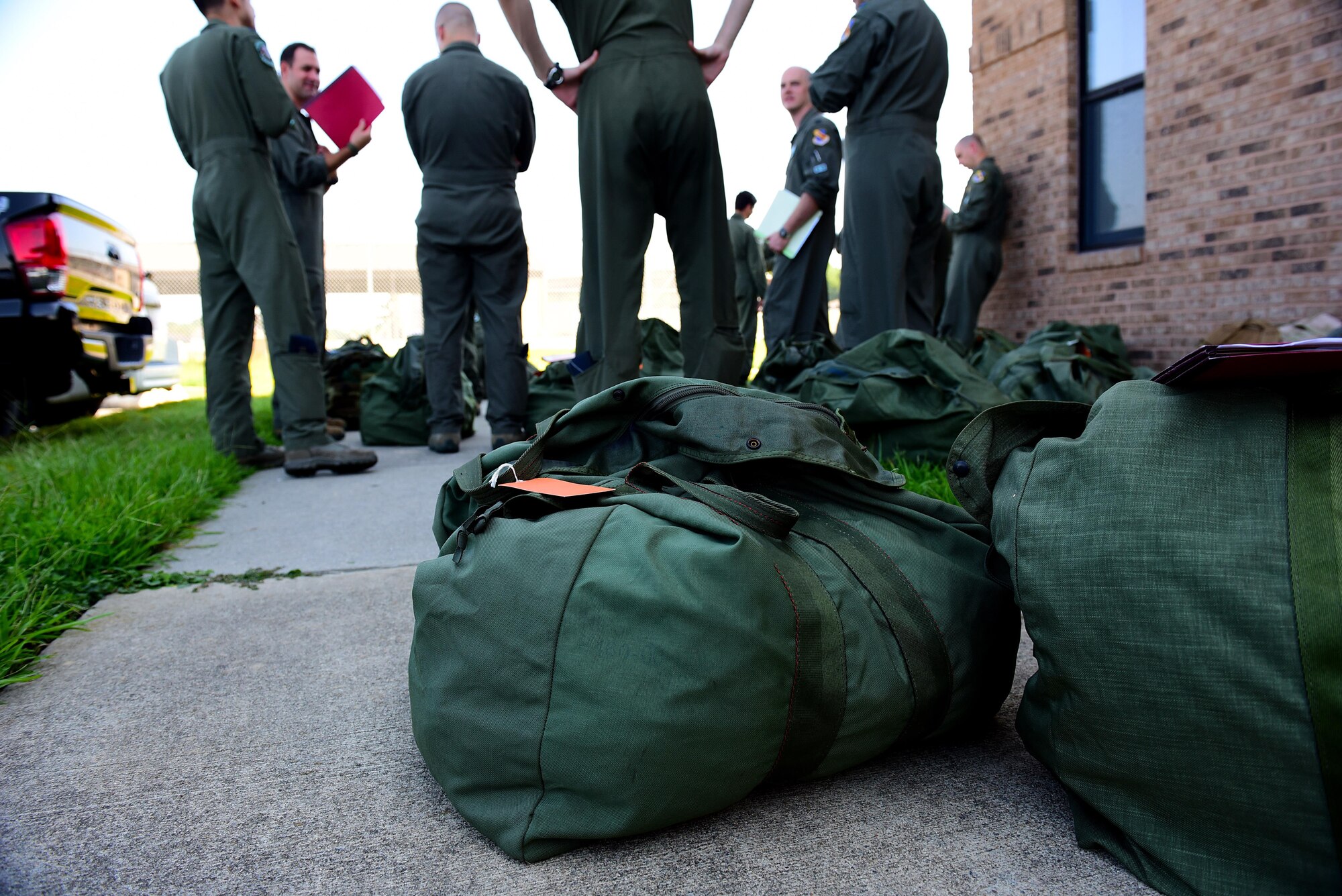 Members of the 335th Fighter Squadron and 335th Aircraft Maintenance Unit wait to be processed through the pre-deployment function processing line during exercise Thunderdome 17-02, July 20, 2017, at Seymour Johnson Air Force Base, North Carolina. The three-day exercise tested Seymour Johnson AFB’s readiness for a short-notice deployment. (U.S. Air Force photo by Airman 1st Class Kenneth Boyton)