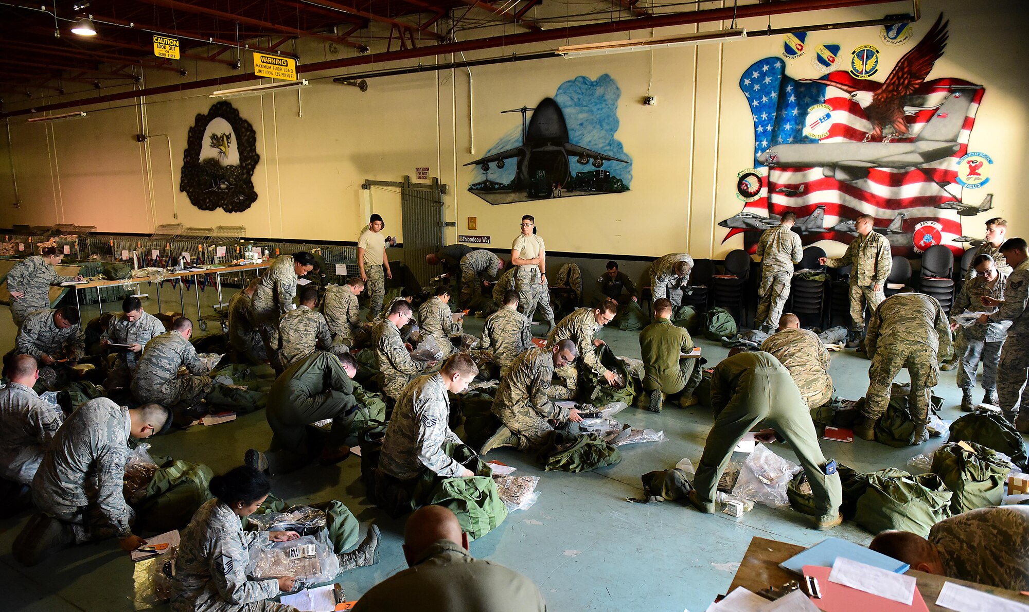 Airmen from the 4th Fighter Wing pack gear for exercise Thunderdome 17-02, July 20, 2017, at Seymour Johnson Air Force Base, North Carolina. While the exercise provided an opportunity to fine-tune the wing’s deployment processes, it also showcased the wing’s readiness in preparing for the potential to rapidly deploy in the future. (U.S. Air Force photo by Airman 1st Class Kenneth Boyton)