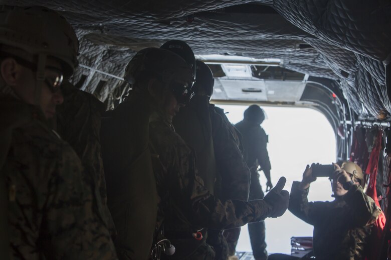 SCHOFIELD BARRACKS – A Marine with 4th Force Reconnaissance Company gives the “thumbs up” signal before conducting a high altitude airborne jump at Schofield Barracks, July 14, 2017. The Marines trained with U.S. Army Special Forces to maintain proficiency in completing static line and high altitude free fall airborne jumps. (U.S. Marine Corps photo by Lance Cpl. Isabelo Tabanguil)