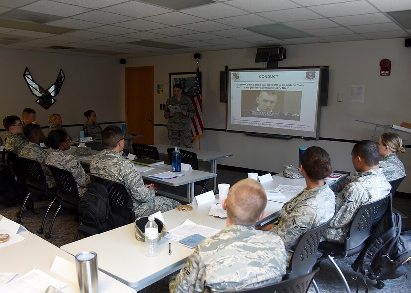 Airmen listen to a briefing during the newly revitalized First Term Airman's Course July 21; 2017; on Grand Forks Air Force Base; N.D. The new curriculum aims to develop Airmen as leaders and is standradized across the Air Force. (U.S. Air Force photo by Senior Airman Ryan Sparks)
