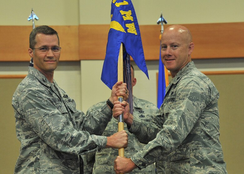 Lt. Col. Jonathan Lawson, right, accepts command of the 341st Logistics Readiness Squadron from Col. Marcus Glenn, 341st Mission Support Group commander, July 21, 2017 at Malmstrom Air Force Base, Mont. (U.S. Air Force photo/John Turner)