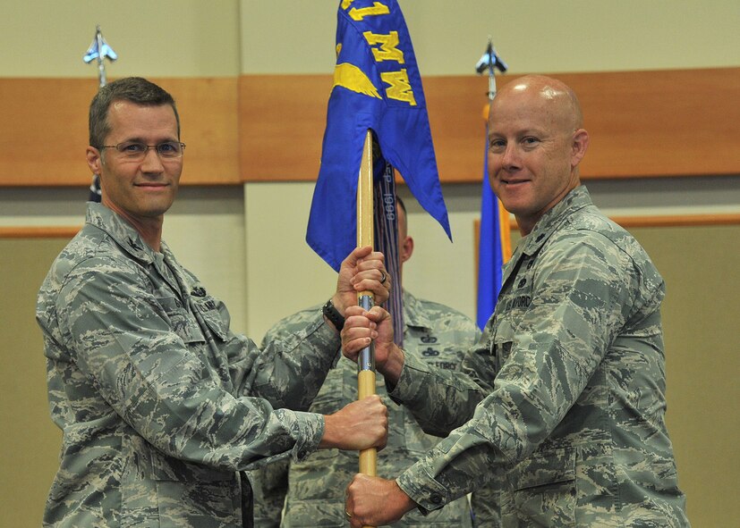 Lt. Col. Jonathan Lawson, right, accepts command of the 341st Logistics Readiness Squadron from Col. Marcus Glenn, 341st Mission Support Group commander, July 21, 2017 at Malmstrom Air Force Base, Mont. (U.S. Air Force photo/John Turner)