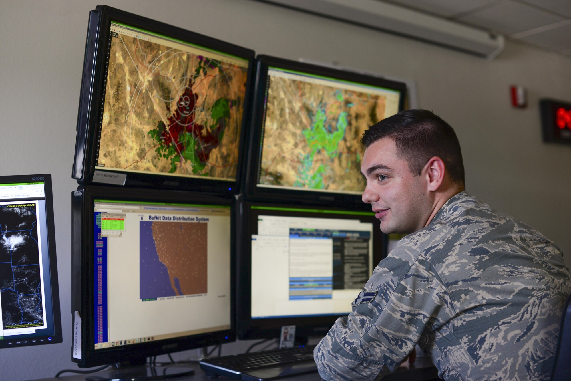 U.S. Air Force Airman 1st Class Cody Leahy, 25th Operational Weather Squadron forecaster, monitors radar at Davis-Monthan Air Force Base, Ariz., July 19, 2017. Leahy was monitoring base wind velocity and weather conditions of Nellis AFB, Nev. (U.S. Air Force photo by Airman 1st Class Michael X. Beyer)