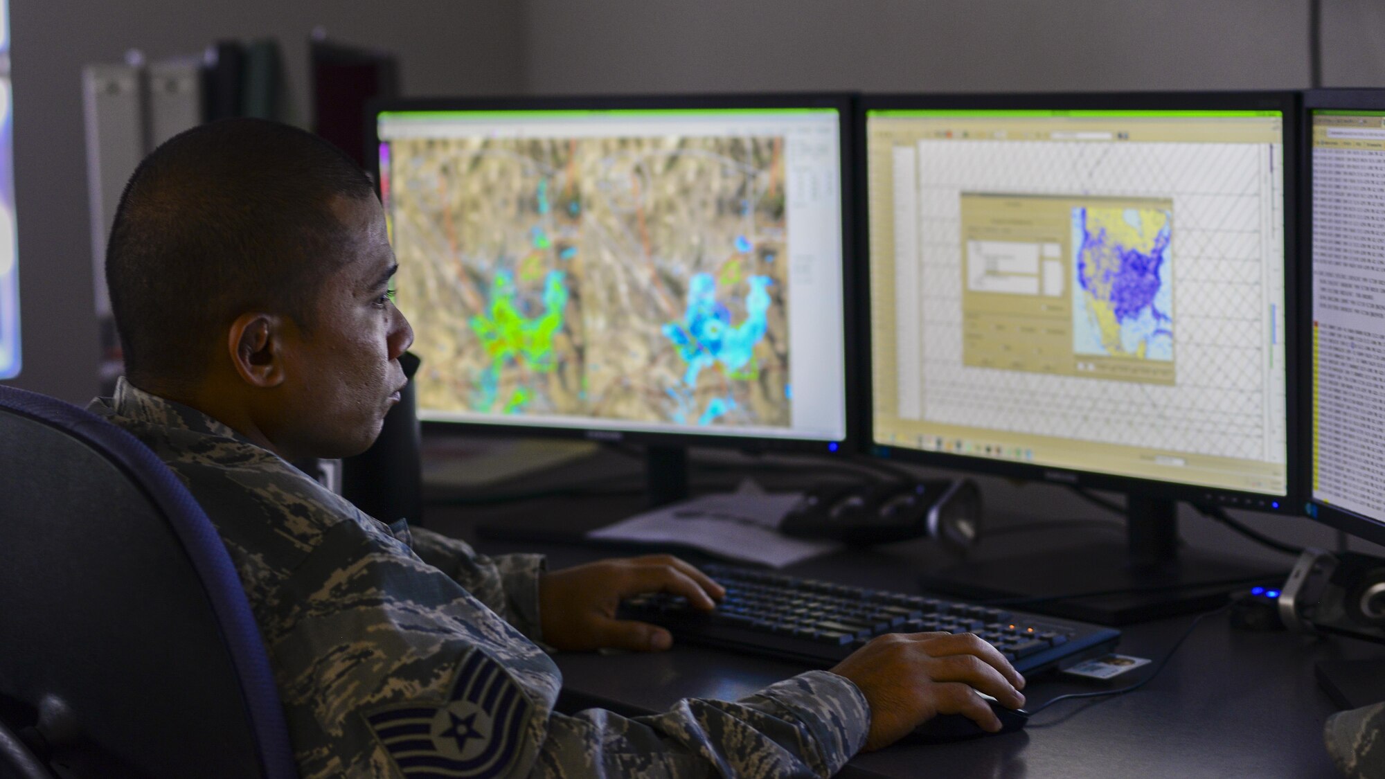 U.S. Air Force Tech. Sgt. Ryan Mendiola, 25th Operational Weather Squadron weather forecaster, monitors weather data at Davis-Monthan Air Force Base, Ariz., July 19, 2017. Forecasters from the 25th OWS monitor weather conditions for the western part of the Continental U.S. (U.S. Air Force photo by Airman 1st Class Michael X. Beyer)