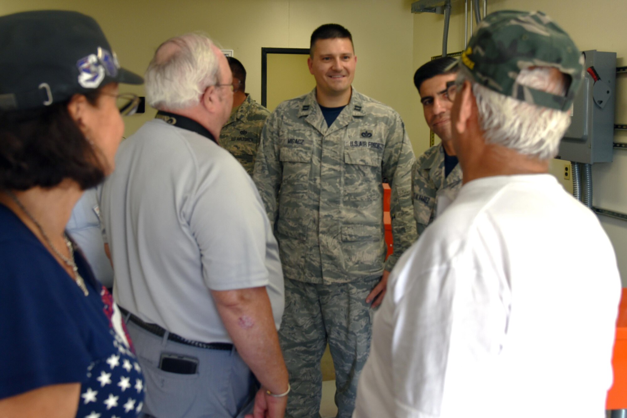 Capt. Ryon Migacz, 366th Training Squadron director of operations, speaks with members of the 555th Red Horse Squadron Vietnam Vets Reunion group during their visit, July 21, 2017. The 355th Red Horse Squadron was one of the first civil engineering units to arrive in Vietnam during the war. (U.S. Air Force photo by 2nd Lt. Jacqueline Jastrzebski)