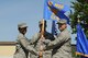 Col. Yvonne Spencer, 92nd Mission Support Group commander, passes the 92nd Civil Engineer Squadron guidon to Lt. Col. Matthew Anderson, 92nd CES commander, during a change of command ceremony July 21, 2017, at Fairchild Air Force Base, Washington. Anderson assumed command from Lt. Col. Ross Gleason. (U.S. Air Force photo/Airman 1st Class Jesenia Landaverde)