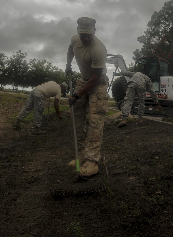 Senior Airman Jason Mohamed, a pavements and construction equipment journeyman with the 1st Special Operations Civil Engineering Squadron, regrades a ditch on Hurlburt Field, Fla., July 18, 2017. The “Dirt Boyz” from the 1st SOCES releveled a ditch outside the 1st Special Operations Medical Group, maintaining efficient storm drains and preventing flooding. (U.S. Air Force photo by Airman 1st Class Rachel Yates)