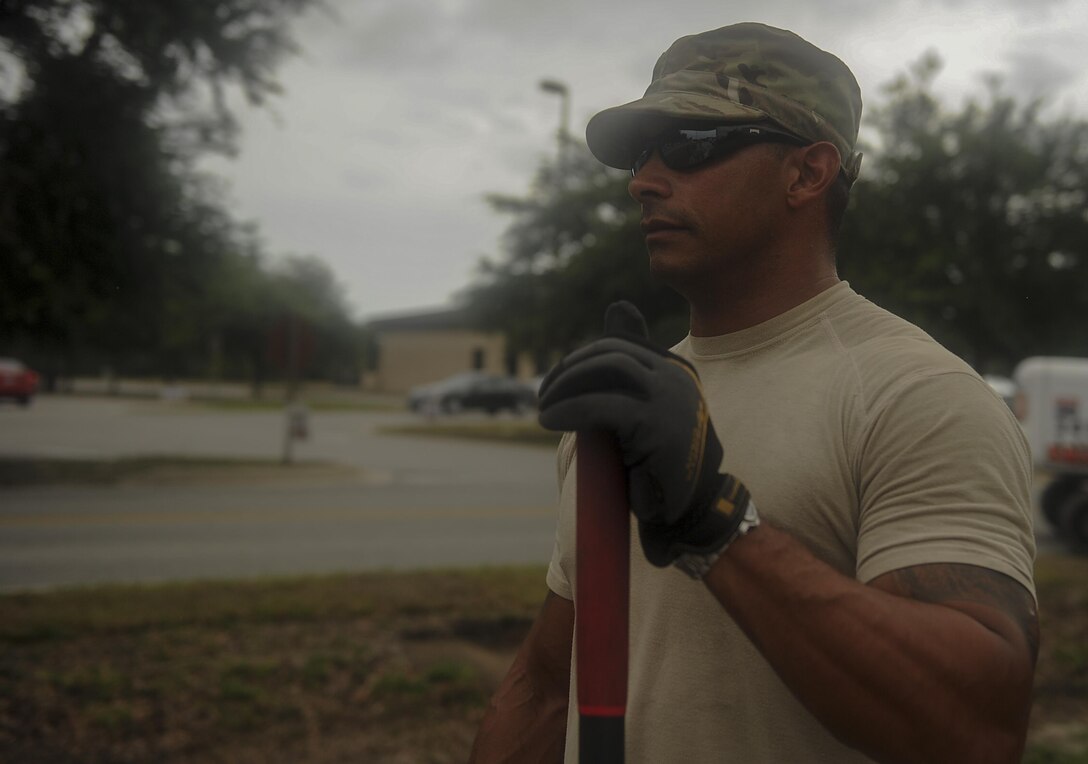 Senior Airman Jason Mohamed, a pavements and construction equipment journeyman with the 1st Special Operations Civil Engineering Squadron, pauses during a construction project at Hurlburt Field, Fla., July 18, 2017. These Airmen, identified as “Dirt Boyz,” are known for their work on roadways, pavements and the surrounding environment on Hurlburt. (U.S. Air Force photo by Airman 1st Class Rachel Yates)
