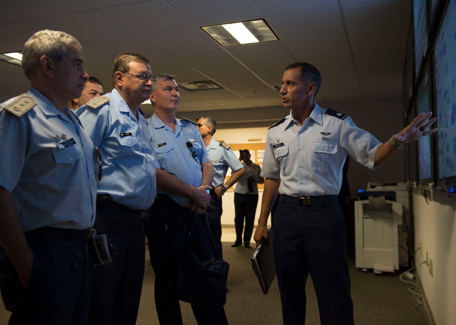 Lt. Col. Alfred Rosales, 6th Attack Squadron commander, explains remotely piloted aircraft operations to a contingent of Argentine air force officials including Brig. Gen. Enrique Amrein, Argentine air force chief of staff, at Holloman Air Force Base, N.M., July 20, 2017. While at Holloman, Amrein learned about the remotely piloted aircraft training program and what pilots, sensor operators and maintainers experience during their time here. (U.S. Air Force photo by Senior Airman Chase Cannon)