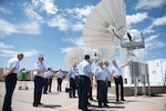 U.S. and Argentine air force members discuss capabilities of remotely piloted aircraft during a visit to Holloman Air Force Base, N.M., July 20, 2017. Brig. Gen. Enrique Amrein, Argentine air force chief of staff, and Lt. Gen. Mark Kelly, 12th Air Force commander, visited Holloman for an immersive look into its RPA training capabilities. (U.S. Air Force photo by Senior Airman Chase Cannon)