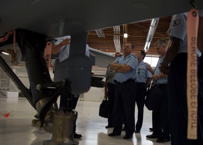 Brig. Gen. Enrique Amrein, Argentine air force chief of staff, learns about the capabilities of an MQ-9 Reaper at Holloman Air Force Base, N.M., July 20, 2017. While at Holloman, Amrein learned about the remotely piloted aircraft training program and what pilots, sensor operators and maintainers experience during their time here. (U.S. Air Force photo by Senior Airman Chase Cannon)