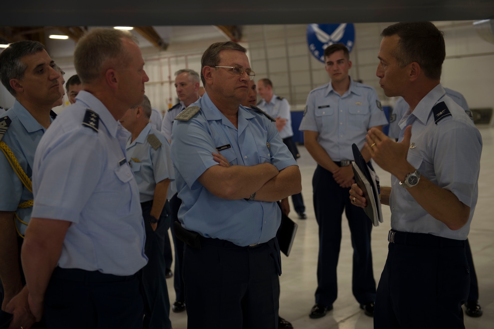 Lt. Gen. Mark Kelly, 12th Air Force commander, (left) Brig. Gen. Enrique Amrein, Argentine air force chief of staff, (center) and Col. Houston Cantwell, 49th Wing commander, (right) discuss capabilities of the MQ-9 Reaper at Holloman Air Force Base, N.M., July 20, 2017. While at Holloman, Amrein learned about the remotely piloted aircraft training program and what pilots, sensor operators and maintainers experience during their time here. (U.S. Air Force photo by Senior Airman Chase Cannon)