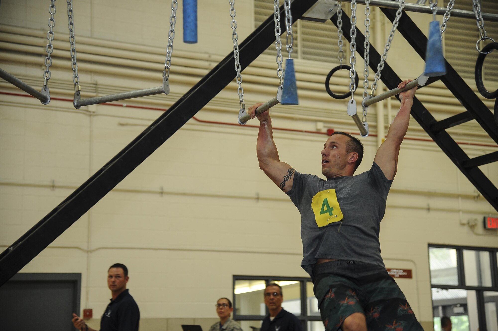 U.S. Air Force Master Sgt. Kevin Sitko, 355th Medical Group training manager, performs on broken bars during the Alpha Warrior Competition at Davis-Monthan Air Force Base, Ariz., July 21, 2017. The top three male and female finalists will move on to the regional competition that is scheduled to be held here in October. (U.S. Air Force photo by Senior Airman Mya M. Crosby)