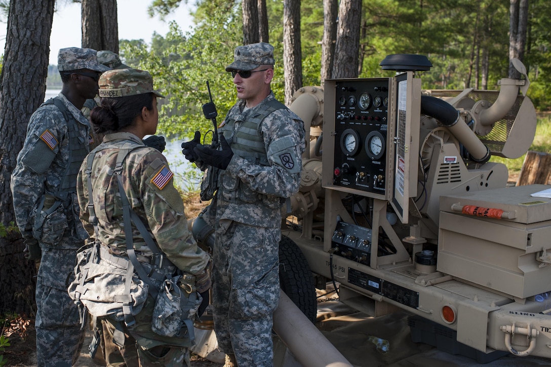 U.S.Army Reserve Sgt. James Powell, with the 728th Quartermaster Company, Fremont, Neb., explains the operation of the Inland Pipeline Distribution System during QLLEX 2017, July 21, at Fort Bragg, NC. QLLEX, short for Quartermaster Liquid Logistics Exercise, is the U.S. Army Reserve’s premier readiness exercise for fuel and water distribution. This year’s QLLEX is not only a full demonstration of the capability, combat-readiness, and lethality of America’s Army Reserve to put fuel and water where it is needed most – in the vehicles and hands of the war-fighter and maneuver units – but it also further exercises the interoperability of the U.S. Army Reserve alongside active Army and British Army logisticians. (U.S. Army Reserve photo by Timothy L. Hale) (Released)