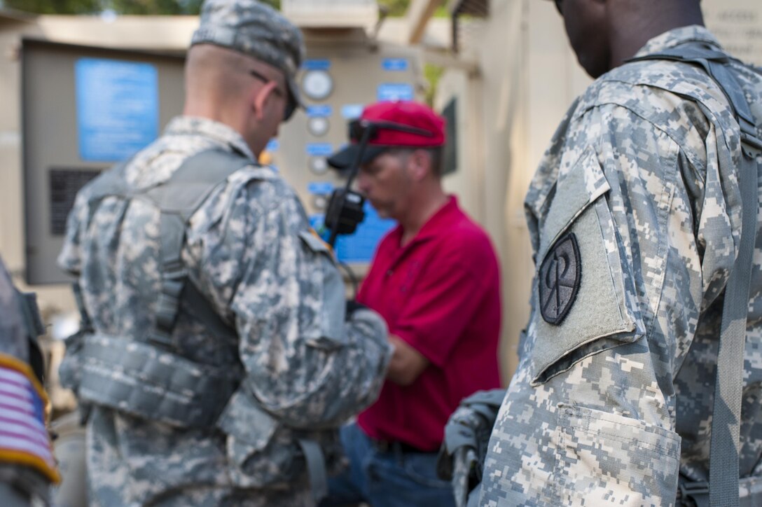 Brandon Howard, with the U.S. Army Forces Command's Petroleum Training Module, Fort Pickett, Va., discusses pump operations to U.S. Army Reserve Soldiers from the 728th Quartermaster Company, Fremont, Neb. during QLLEX 2017, July 21, at Fort Bragg, NC. QLLEX, short for Quartermaster Liquid Logistics Exercise, is the U.S. Army Reserve’s premier readiness exercise for fuel and water distribution. This year’s QLLEX is not only a full demonstration of the capability, combat-readiness, and lethality of America’s Army Reserve to put fuel and water where it is needed most – in the vehicles and hands of the war-fighter and maneuver units – but it also further exercises the interoperability of the U.S. Army Reserve alongside active Army and British Army logisticians. (U.S. Army Reserve photo by Timothy L. Hale) (Released)