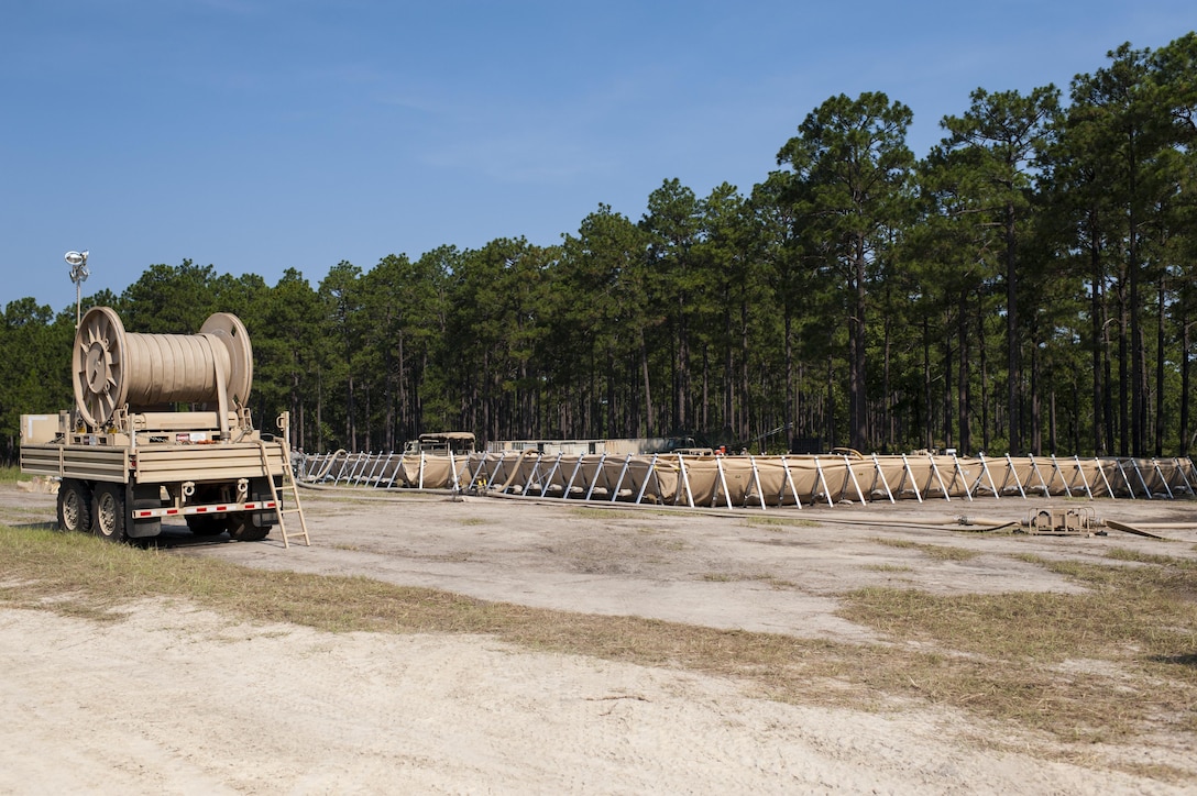 A 50K tactical petroleum terminal in operation during QLLEX 2017, July 21, at Fort Bragg, NC. QLLEX, short for Quartermaster Liquid Logistics Exercise, is the U.S. Army Reserve’s premier readiness exercise for fuel and water distribution. This year’s QLLEX is not only a full demonstration of the capability, combat-readiness, and lethality of America’s Army Reserve to put fuel and water where it is needed most – in the vehicles and hands of the war-fighter and maneuver units – but it also further exercises the interoperability of the U.S. Army Reserve alongside active Army and British Army logisticians. (U.S. Army Reserve photo by Timothy L. Hale) (Released)