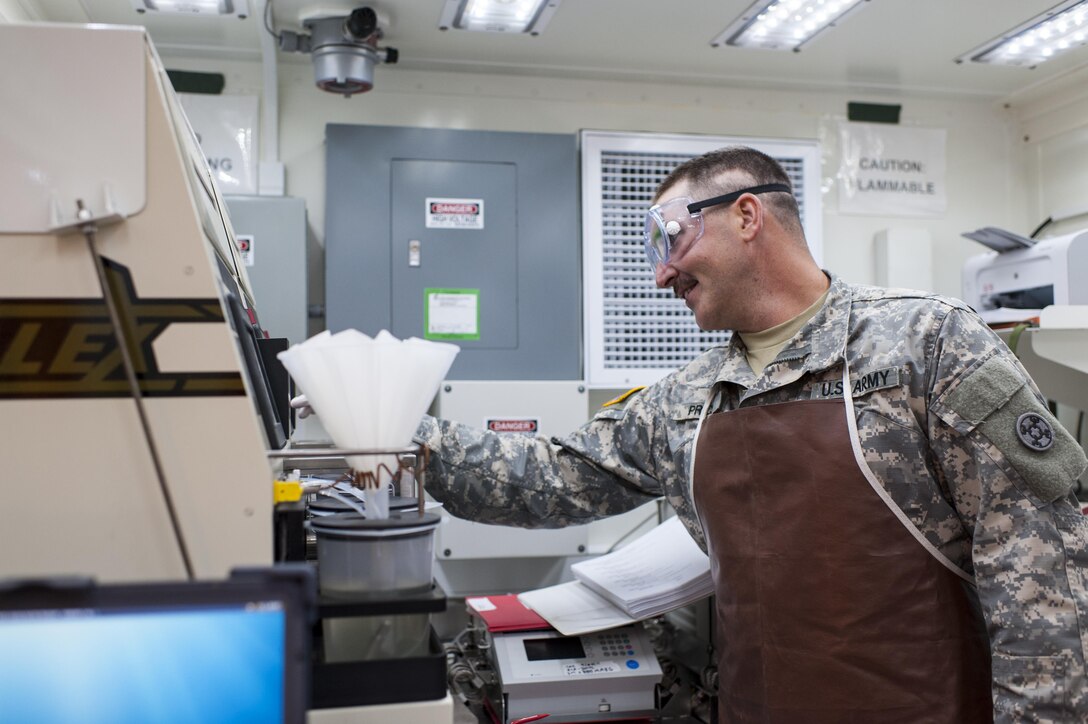 U.S. Army Reserve Spc. Andrew Price, a petroleum lab specialist with the 373rd Quartermaster Battalion, Jeffersonville, Ind., tests a fuel sample during QLLEX 2017, July 21, at Fort Bragg, NC. QLLEX, short for Quartermaster Liquid Logistics Exercise, is the U.S. Army Reserve’s premier readiness exercise for fuel and water distribution. This year’s QLLEX is not only a full demonstration of the capability, combat-readiness, and lethality of America’s Army Reserve to put fuel and water where it is needed most – in the vehicles and hands of the war-fighter and maneuver units – but it also further exercises the interoperability of the U.S. Army Reserve alongside active Army and British Army logisticians. (U.S. Army Reserve photo by Timothy L. Hale) (Released)