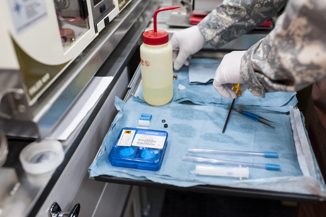 U.S. Army Reserve Spc. Andrew Price, a petroleum lab specialist with the 373rd Quartermaster Battalion, Jeffersonville, Ind., organizes tools and instruments during QLLEX 2017, July 21, at Fort Bragg, NC. QLLEX, short for Quartermaster Liquid Logistics Exercise, is the U.S. Army Reserve’s premier readiness exercise for fuel and water distribution. This year’s QLLEX is not only a full demonstration of the capability, combat-readiness, and lethality of America’s Army Reserve to put fuel and water where it is needed most – in the vehicles and hands of the war-fighter and maneuver units – but it also further exercises the interoperability of the U.S. Army Reserve alongside active Army and British Army logisticians. (U.S. Army Reserve photo by Timothy L. Hale) (Released)