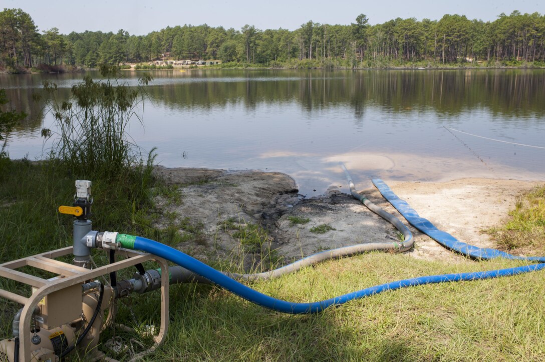 Water is pulled from MacArthur Lake and turned into potable water through reverse osmosis during QLLEX 2017, July 21, at Fort Bragg, NC. QLLEX, short for Quartermaster Liquid Logistics Exercise, is the U.S. Army Reserve’s premier readiness exercise for fuel and water distribution. This year’s QLLEX is not only a full demonstration of the capability, combat-readiness, and lethality of America’s Army Reserve to put fuel and water where it is needed most – in the vehicles and hands of the war-fighter and maneuver units – but it also further exercises the interoperability of the U.S. Army Reserve alongside active Army and British Army logisticians. (U.S. Army Reserve photo by Timothy L. Hale) (Released)