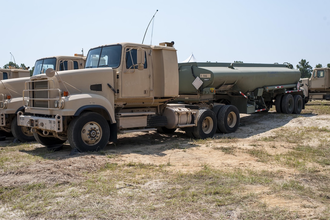 Military tanker trucks from five U.S. Army Reserve transportation units in Georgia, Illinois, Michigan, South Carolina, and Texas, are running fuel to customers at during QLLEX 2017, July 21, at Fort Bragg, NC. QLLEX, short for Quartermaster Liquid Logistics Exercise, is the U.S. Army Reserve’s premier readiness exercise for fuel and water distribution. This year’s QLLEX is not only a full demonstration of the capability, combat-readiness, and lethality of America’s Army Reserve to put fuel and water where it is needed most – in the vehicles and hands of the war-fighter and maneuver units – but it also further exercises the interoperability of the U.S. Army Reserve alongside active Army and British Army logisticians. (U.S. Army Reserve photo by Timothy L. Hale) (Released)