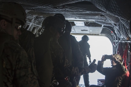 SCHOFIELD BARRACKS – A Marine with 4th Force Reconnaissance Company gives the “thumbs up” signal before conducting a high altitude airborne jump at Schofield Barracks, July 14, 2017. The Marines trained with U.S. Army Special Forces to maintain proficiency in completing static line and high altitude free fall airborne jumps. (U.S. Marine Corps photo by Lance Cpl. Isabelo Tabanguil)
