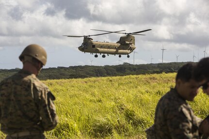 SCHOFIELD BARRACKS – A CH-47 Chinook helicopter prepares to land during an airborne parachute training exercise at Schofield Barracks, July 14, 2017. Marines with 4th Force Reconnaissance Company trained with U.S. Army Special Forces to maintain proficiency in completing static line and high altitude free fall airborne jumps. (U.S. Marine Corps photo by Lance Cpl. Isabelo Tabanguil)