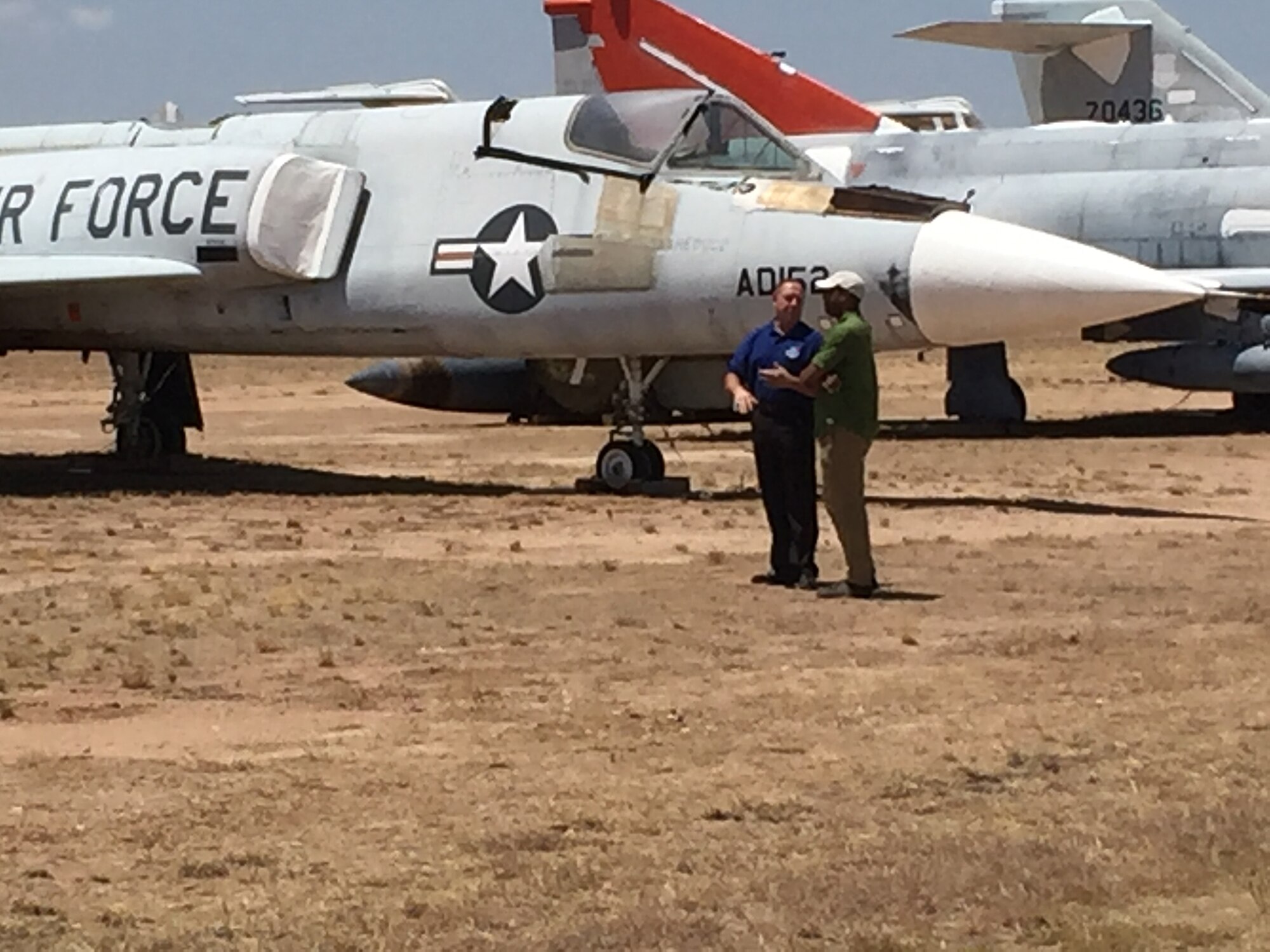 Tim Gray, 309th Aircraft Maintenance Group deputy director, conducts an interview with Craig Melvin on display row July 13 at Davis-Monthan Air Force Base, Ariz. The interview is scheduled to air as part of NBC’s Weekend Today live broadcast on July 29. (Courtesy photo)