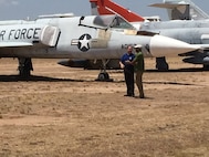 Tim Gray, 309th Aircraft Maintenance Group deputy director, conducts an interview with Craig Melvin on display row July 13 at Davis-Monthan Air Force Base, Ariz. The interview is scheduled to air as part of NBC’s Weekend Today live broadcast on July 29. (Courtesy photo)