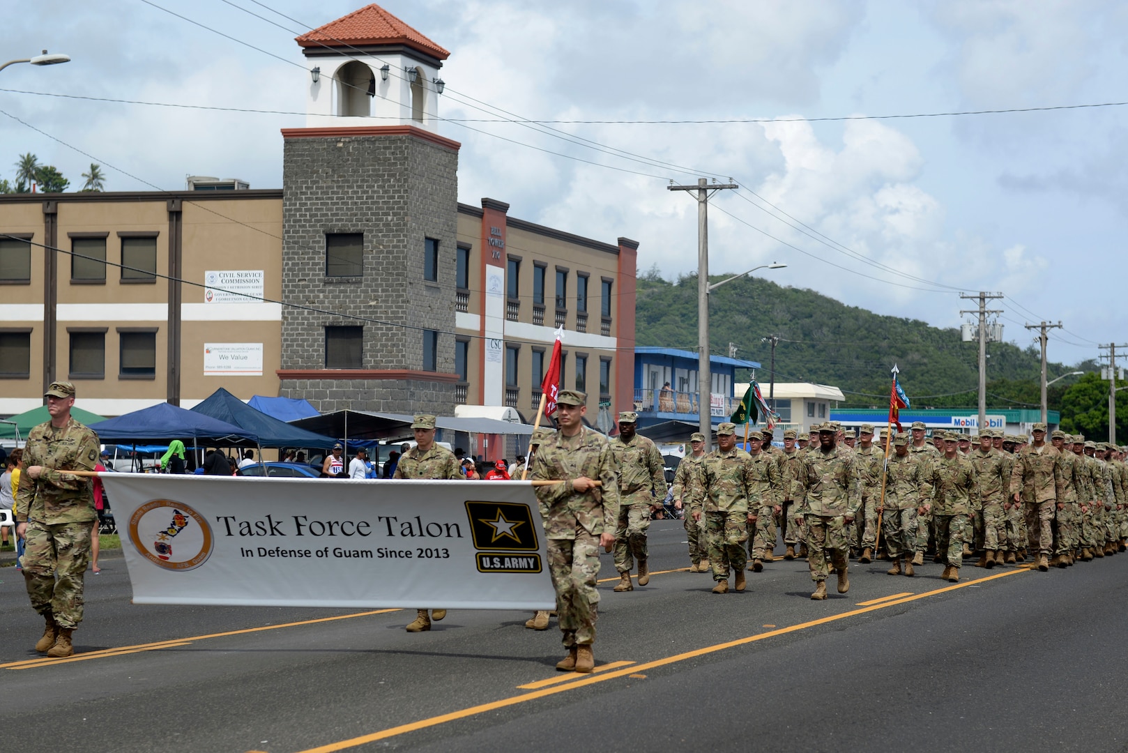 U.S. Soldiers assigned to Task Force Talon, 94th Army and Missile Command, and local citizens participate in the 73rd Guam Liberation Day parade July 21, 2017, in Hagåtña, Guam. Liberation Day is celebrated every year on July 21 to mark the day Guam was liberated by U.S armed forces from Japanese occupation in 1944. (U.S. Air Force photo by Airman 1st Class Gerald R. Willis)