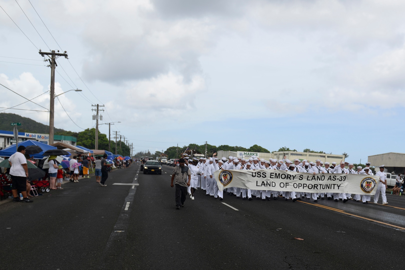 U.S. Sailors assigned to the USS Emory S. Land greet bystanders during the 73rd Guam Liberation Day parade July 21, 2017, in Hagåtña, Guam. The parade commemorated 73 years since U.S. armed forces liberated the island from Japanese control during World War II. (U.S. Air Force photo by Airman 1st Class Gerald R. Willis)