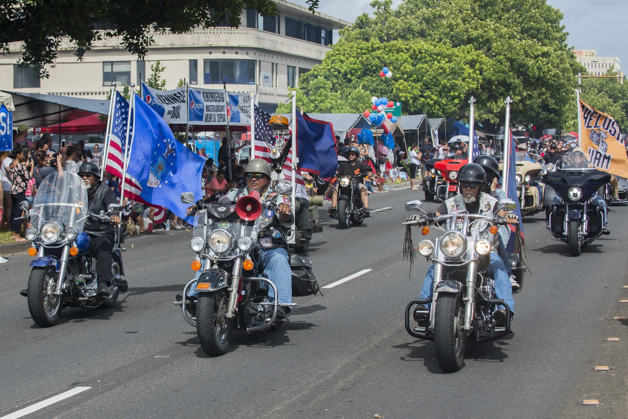 U.S Service members and local citizens participate in the 73rd Guam Liberation Day parade July 21, 2017, in Hagåtña, Guam. The parade commemorated 73 years since U.S. armed forces liberated the island from Japanese occupation. During World War II, Japan seized Guam on December 10, 1941, and on July 21, 1944, the U.S. armed forces liberated the island. (U.S. Air Force photo by Airman 1st Class Christopher Quail)