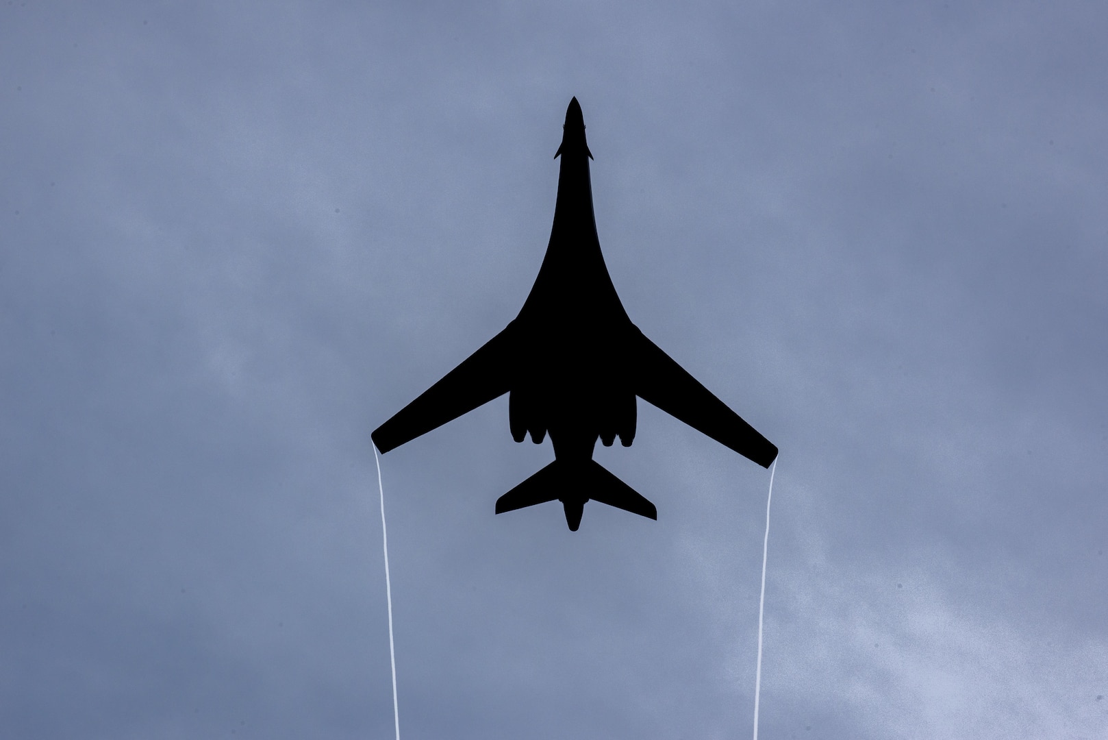 A B1-B Lancer assigned to the 9th Expeditionary Bomb Squadron flies over the 73rd Guam Liberation Day parade July 21, 2017, in Hagåtña, Guam. The parade commemorated 73 years since U.S. armed forces liberated the island from Japanese occupation. During World War II, Japan seized Guam on December 10, 1941, and on July 21, 1944, the U.S. armed forces liberated the island. (U.S. Air Force photo by Airman 1st Class Christopher Quail)