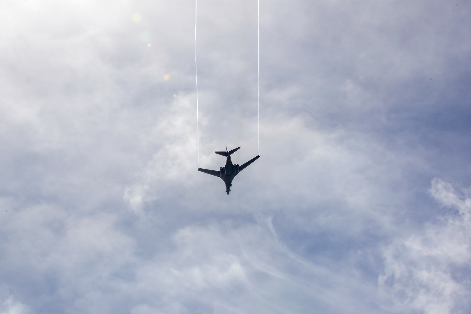 A B1-B Lancer assigned to the 9th Expeditionary Bomb Squadron flies over the 73rd Guam Liberation Day parade July 21, 2017, in Hagåtña, Guam. The parade commemorated 73 years since U.S. armed forces liberated the island from Japanese occupation. During World War II, Japan seized Guam on December 10, 1941, and on July 21, 1944, the U.S. armed forces liberated the island. (U.S. Air Force photo by Airman 1st Class Christopher Quail)