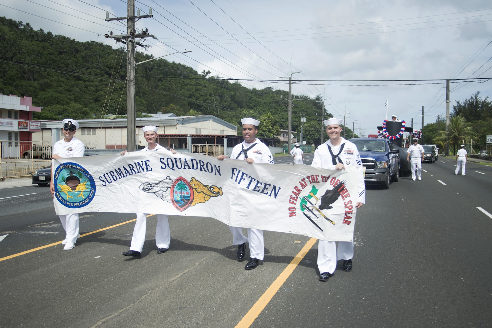 170721-N-JN506-028 HAGATNA, Guam (July 21, 2017) – Sailors from Commander, Submarine Squadron 15 carry a banner during Guam's annual Liberation Day Parade in Hagatna, Guam, July 21. The 2017 Guam Liberation Parade celebrates the 73rd anniversary of the liberation of Guam from Japanese occupation by U.S. forces during World War II. (U.S. Navy photo by Mass Communication Specialist 1st Class Jamica Johnson/Released)