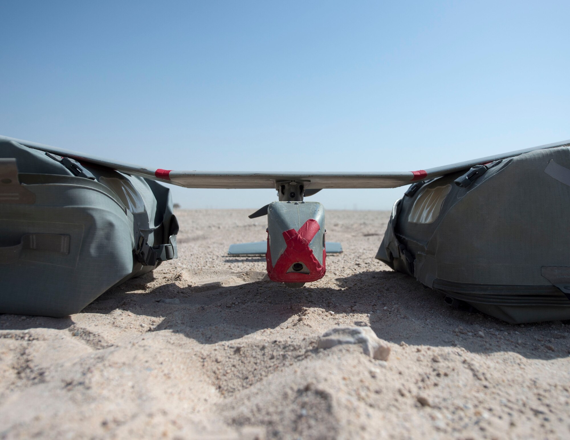 A RQ-11 Raven with the 379th Expeditionary Security Forces Squadron waits for take-off at Al Udeid Air Base, Qatar, July 3, 2017. The RQ-11 Raven is a small unmanned aircraft system which provides real-time imagery or video for the 379th ESFS. (U.S. Air Force photo by Tech. Sgt. Amy M. Lovgren)